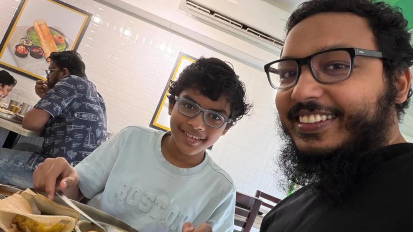Family meal at a restaurant with chicken puffs and breakfast dishes on the table